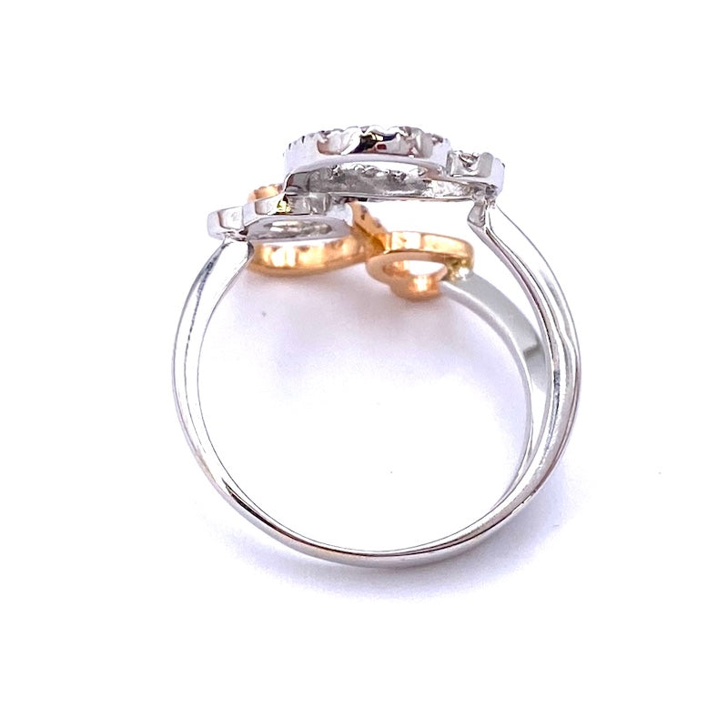 Anello cuori contrariè, zirconi, oro bianco e rosa; 4.93 gr