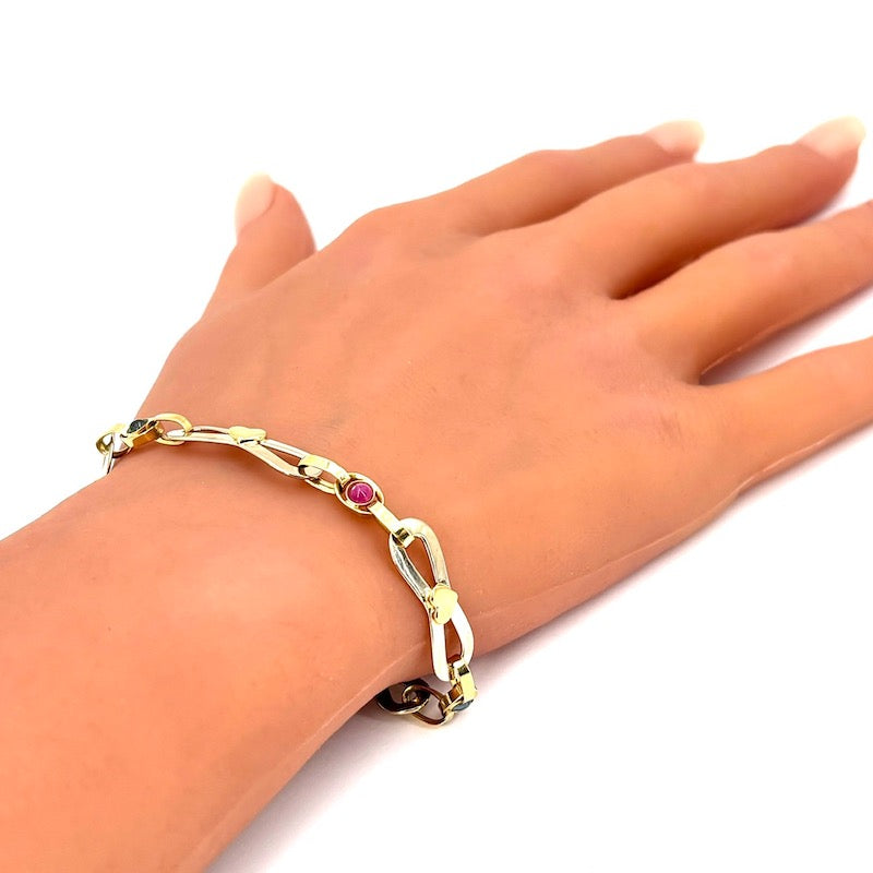 Bracciale catena fiocchi oro bicolore, zaffiri e rubini; 4.12 gr - 19.5 cm