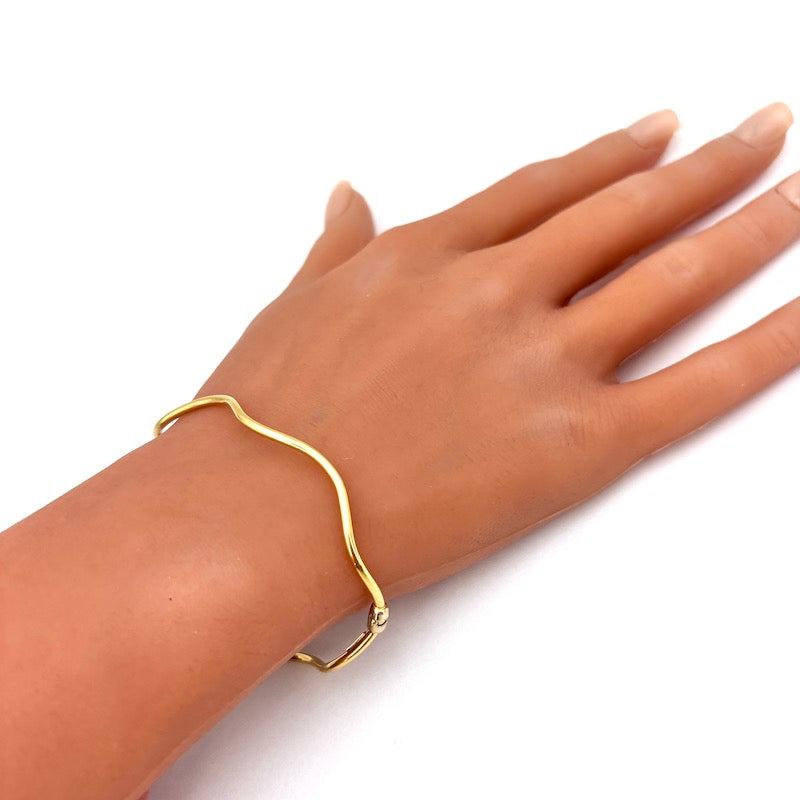 Bracciale cerchio rigido ondulato, oro giallo; 3.35 gr