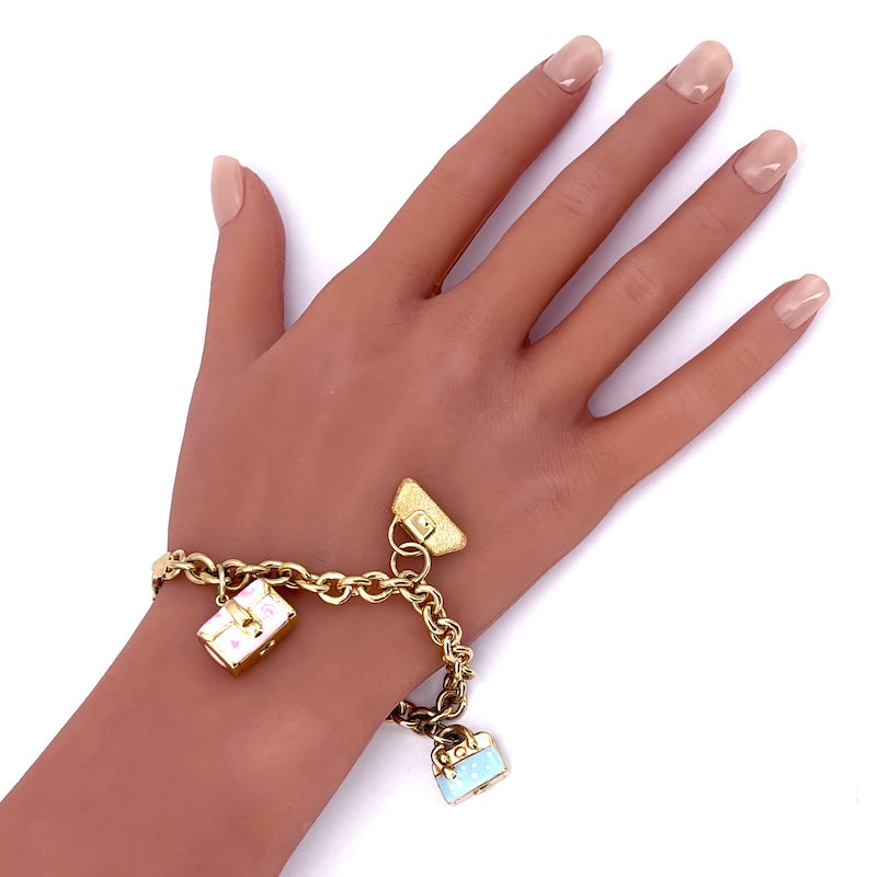 Bracciale charms borsette, oro 18 kt; 19.3 gr