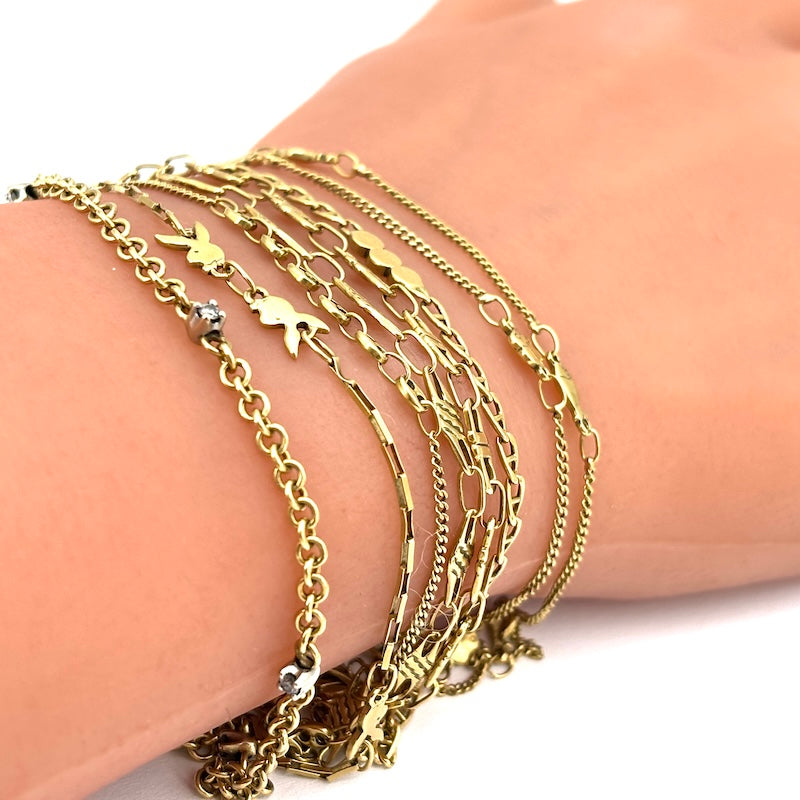 Bracciale mille fili, 8 catene varie, in oro giallo; 18 cm - 21.61 gr