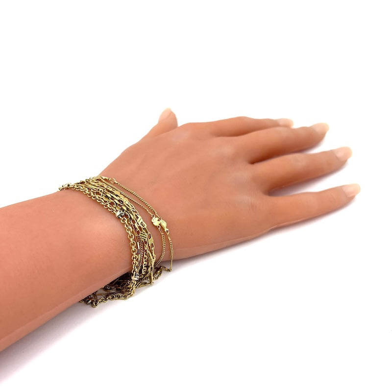 Bracciale mille fili, 8 catene varie, in oro giallo; 18 cm - 21.61 gr