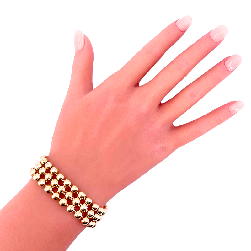 Bracciale polsino a 3 file palline oro giallo; 33 gr; 19 cm