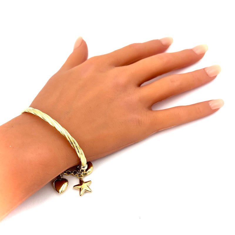 Bracciale semirigido con charms stelle, lune e cuore, oro giallo; 12.8 gr