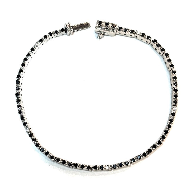 Bracciale tennis brillanti neri e bianchi, oro bianco; 7.7 gr - 15.3 cm