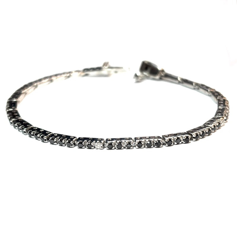 Bracciale tennis brillanti neri e bianchi, oro bianco; 7.7 gr - 15.3 cm