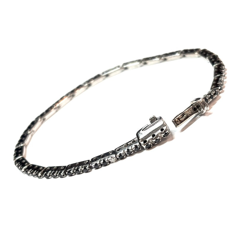 Bracciale tennis brillanti neri e bianchi, oro bianco; 7.7 gr - 15.3 cm