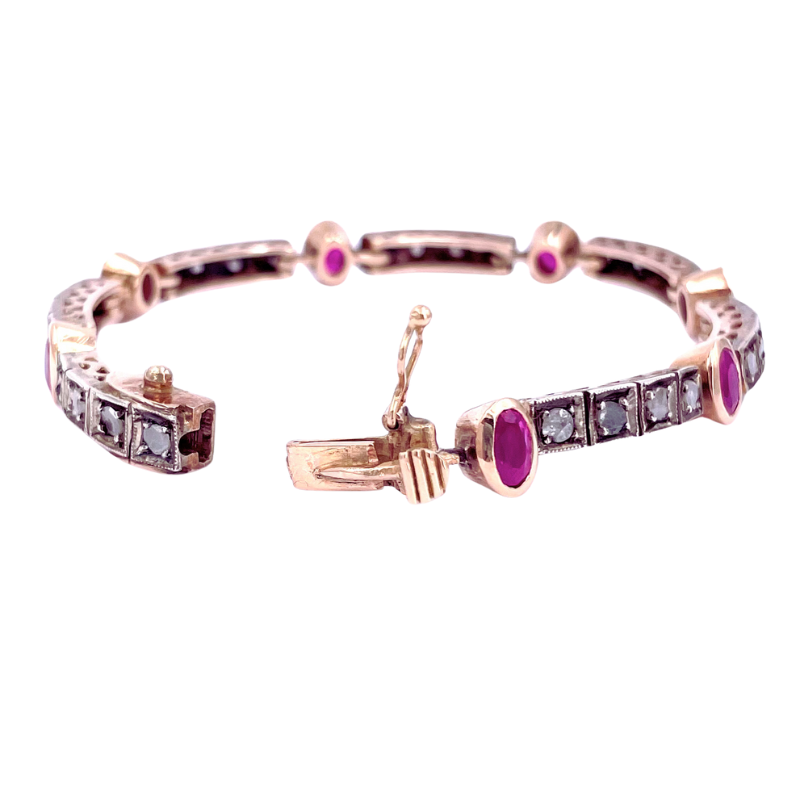 Bracciale tennis in stile antico, rubini e diamanti; 1-1.20 ct; 18 cm - 21.48 gr.