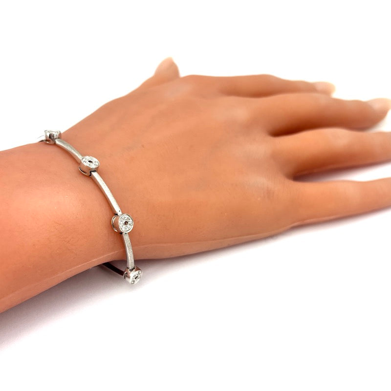 Bracciale tennis oro bianco e cerchietti zirconi; 12.22 gr - 18 cm