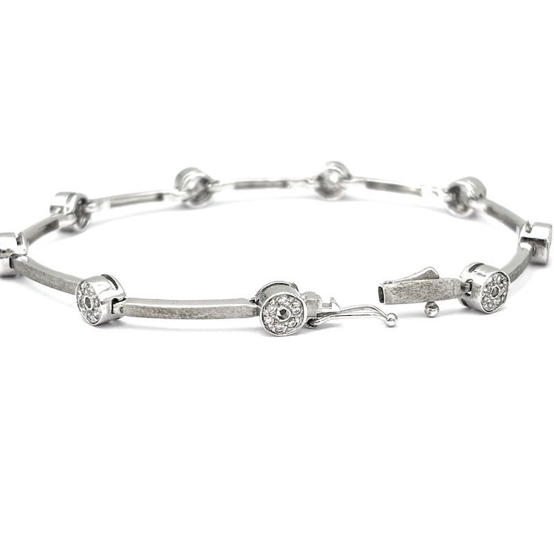 Bracciale tennis oro bianco e cerchietti zirconi; 12.22 gr - 18 cm