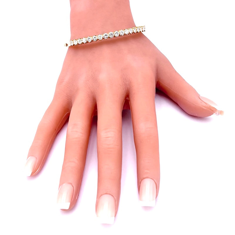 Bracciale tennis rigido oro giallo e brillanti; 16.6 gr