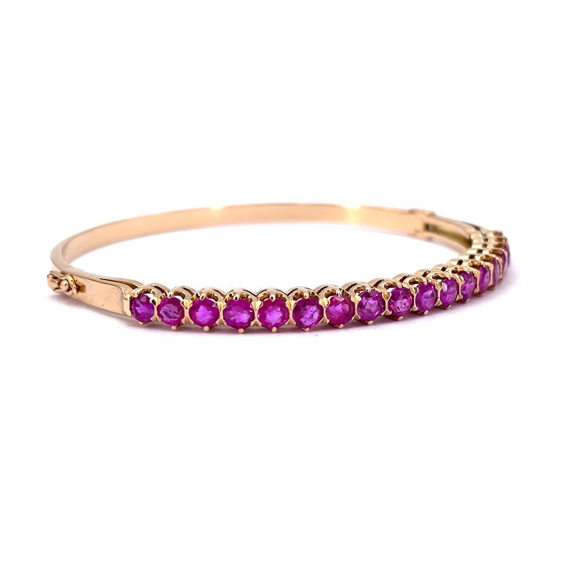 Bracciale tennis rigido oro giallo e rubini; 16.49 gr