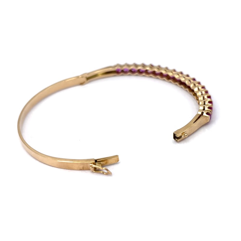Bracciale tennis rigido oro giallo e rubini; 16.49 gr