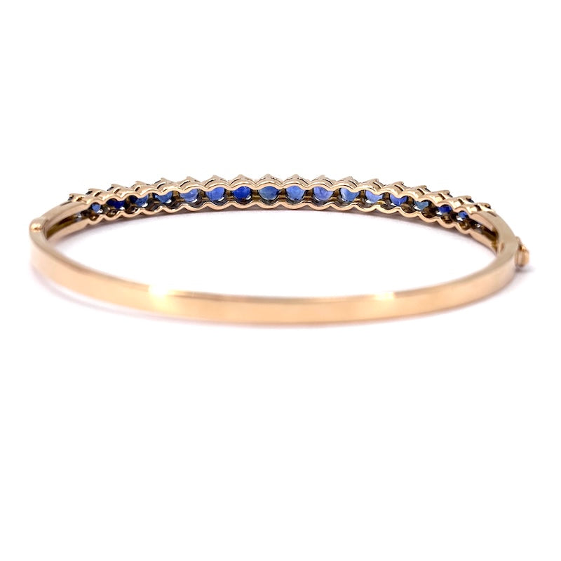 Bracciale tennis rigido oro giallo e zaffiri; 16.78 gr