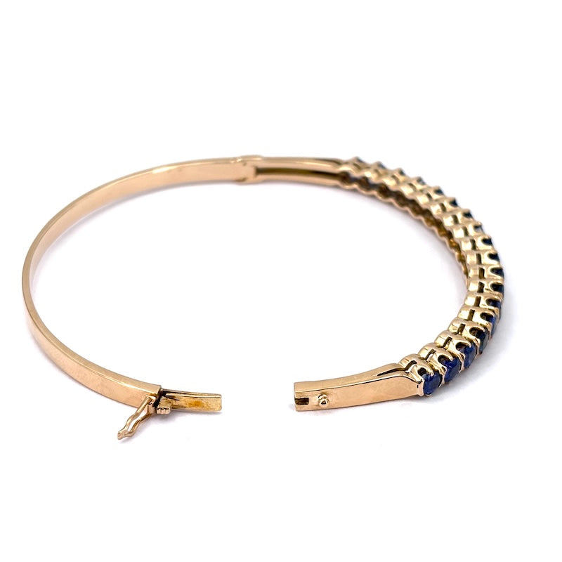 Bracciale tennis rigido oro giallo e zaffiri; 16.78 gr
