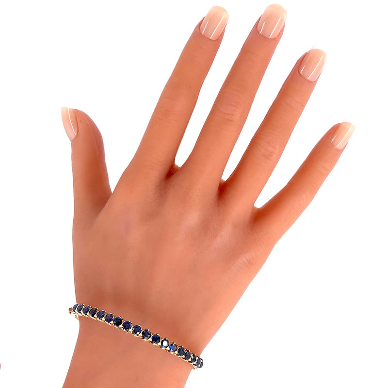 Bracciale tennis rigido oro giallo e zaffiri; 16.78 gr