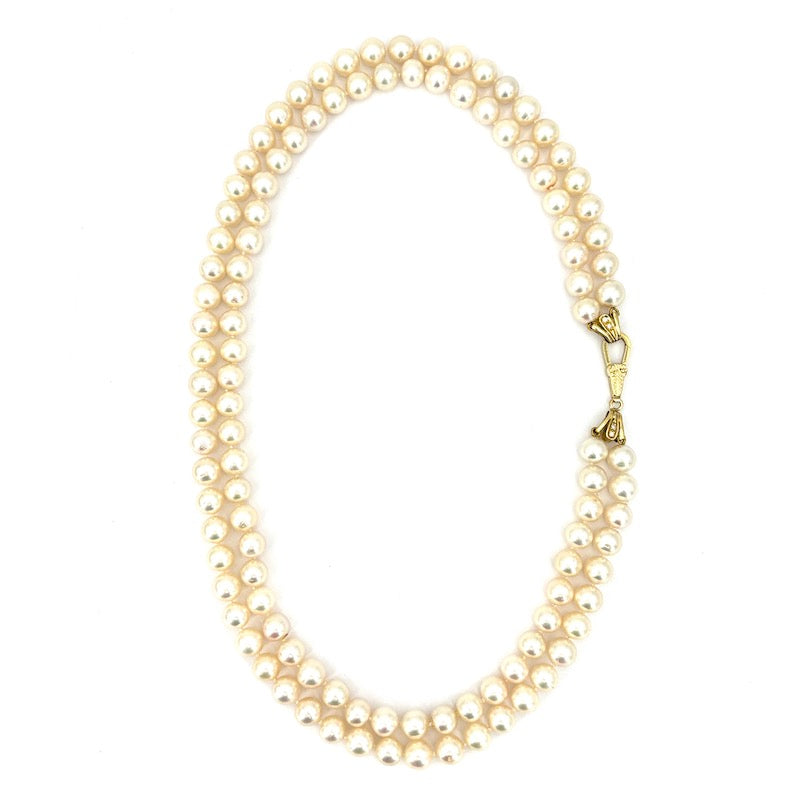 Collana perle doppia, chiusura e cappette in stile oro e brillanti; 85.53 gr - 48 cm