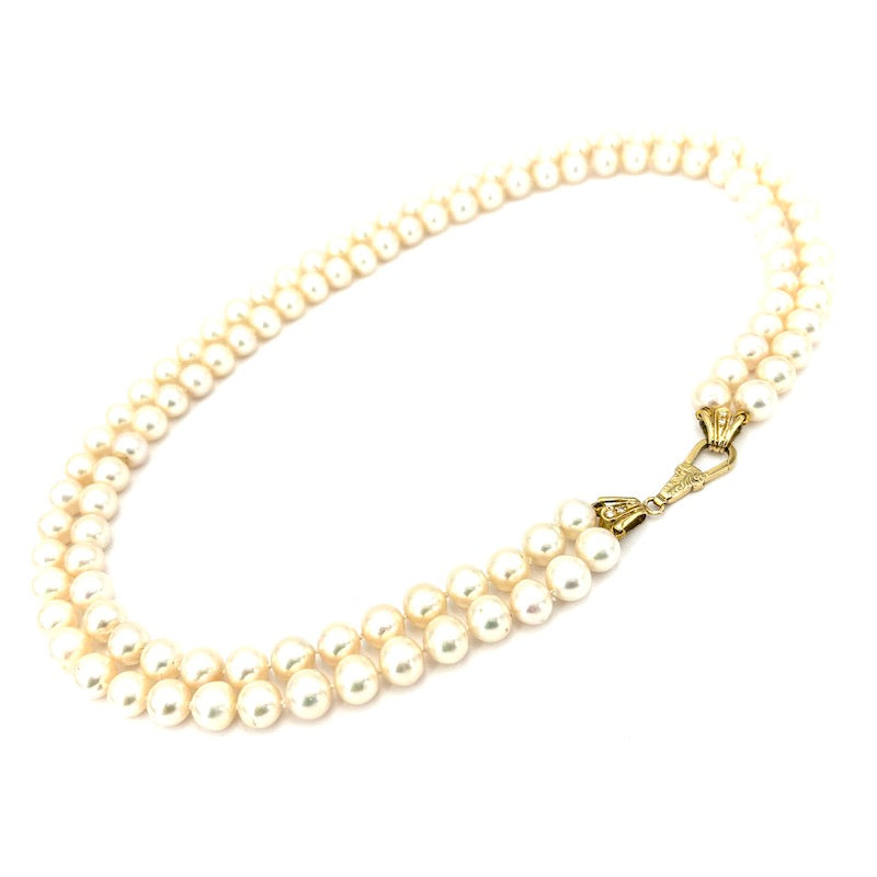 Collana perle doppia, chiusura e cappette in stile oro e brillanti; 85.53 gr - 48 cm