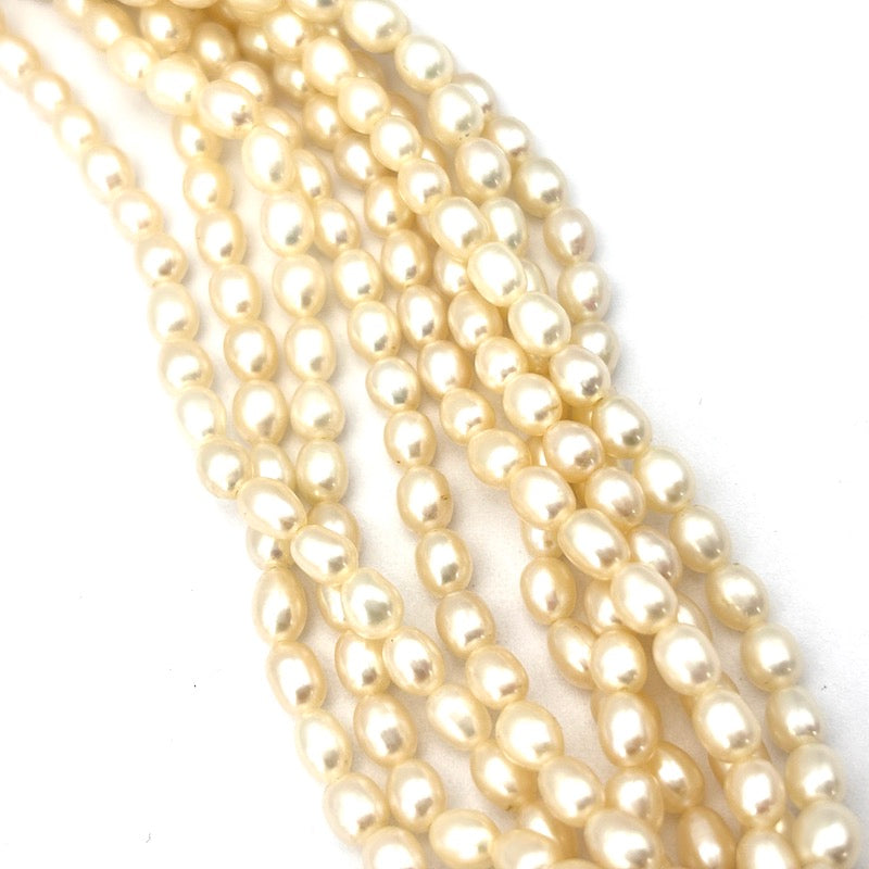 Collana torchon 9 fili microperle e fiocco oro - 54 cm; 128 gr