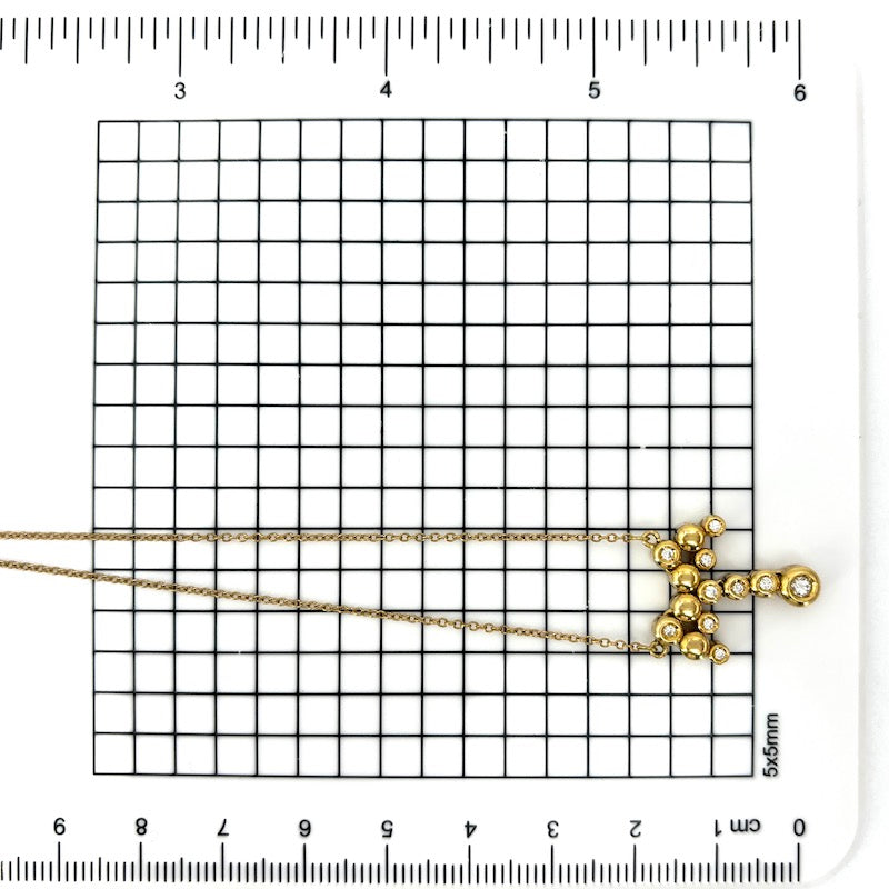 Collier girocollo con ciondolo fiocco oro giallo e brillanti; 5.44 gr